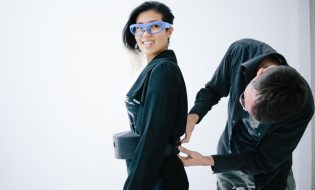 The glasses at Hussein Chalayans runway show on Sept. 30, 2016, are connected to a wearers belt. The belt includes an Intel Compute Stick, a tiny computing device the size of a pack of gum that captures the biometric data and translates it by projecting visualizations interpreting the wearers stress level onto a wall via a small Pico projector. Paris Fashion Weeks Spring/Summer 2017 event runs Sept. 27-Oct. 5, 2016. (Credit: Intel Corporation)