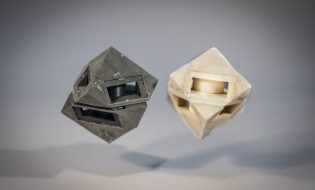 MIT researchers outfitted their cube robot with shock-absorbing “skins” (left) that transfer less than half of the energy that would normally be transferred to the ground.