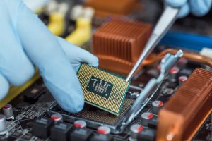 Engineer holding computer chip